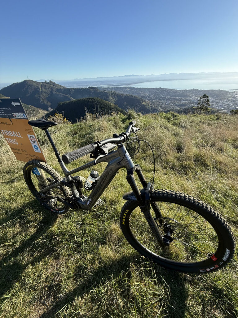 Santa Cruz Vala 2026 Alloy leaning against a trail sign in Nelson NZ